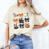 Custom Halloween coquette black and orange desing natural T-Shirt