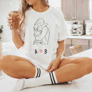White women's t-shirt with hugging couple and initials.